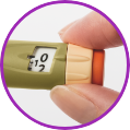 Icon of a hand holding an insulin pen with a beige and orange cap, enclosed in a purple border.
